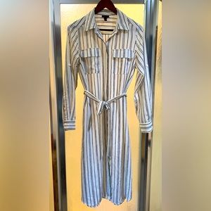 White blouse-style dress with waist tie.